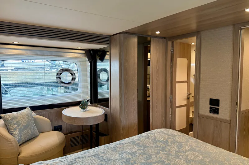 Slide: The Image of Luxurious interior of 2020 Azimut Magellano 66 yacht cabin with elegant furnishings. - 52