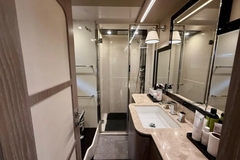 Slide: The Image of Luxurious bathroom on 2020 Azimut Magellano 66 yacht with modern fixtures and elegant design. - 58