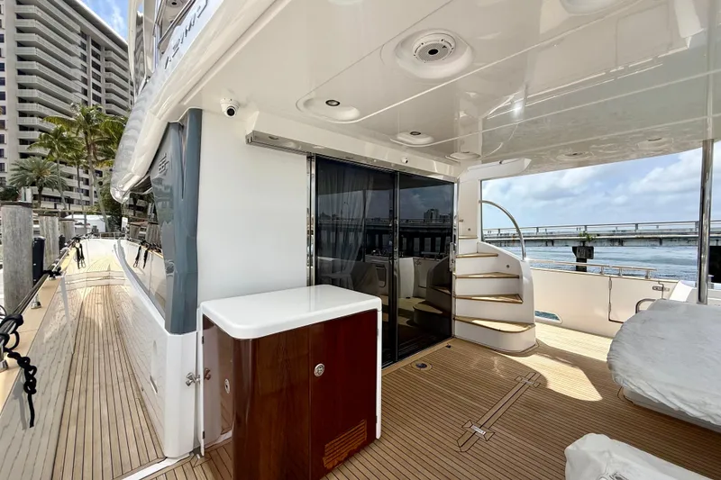 Slide: The Image of Luxurious 2020 Azimut Magellano 66 yacht deck with elegant wood finish and modern amenities. - 6