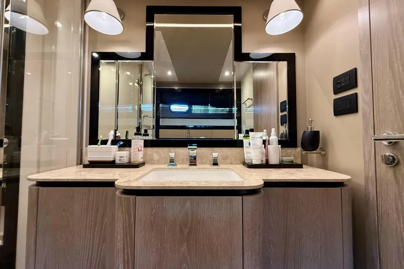Slide: The Image of Luxurious bathroom interior on a 2020 Azimut Magellano 66 yacht, featuring modern fixtures. - 61