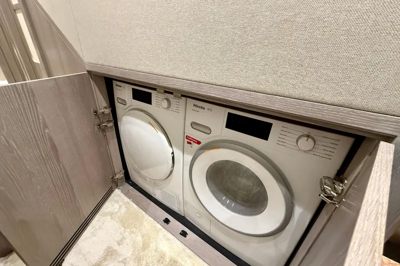 Slide: The Image of Laundry appliances in the 2020 Azimut Magellano 66 yacht's interior compartment. - 63