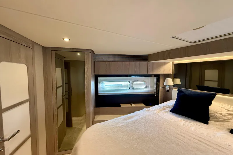 Slide: The Image of Luxurious bedroom interior of 2020 Azimut Magellano 66 yacht with modern design elements. - 68