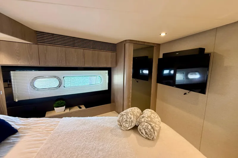 Slide: The Image of Luxurious interior of 2020 Azimut Magellano 66 yacht with modern decor and amenities. - 70