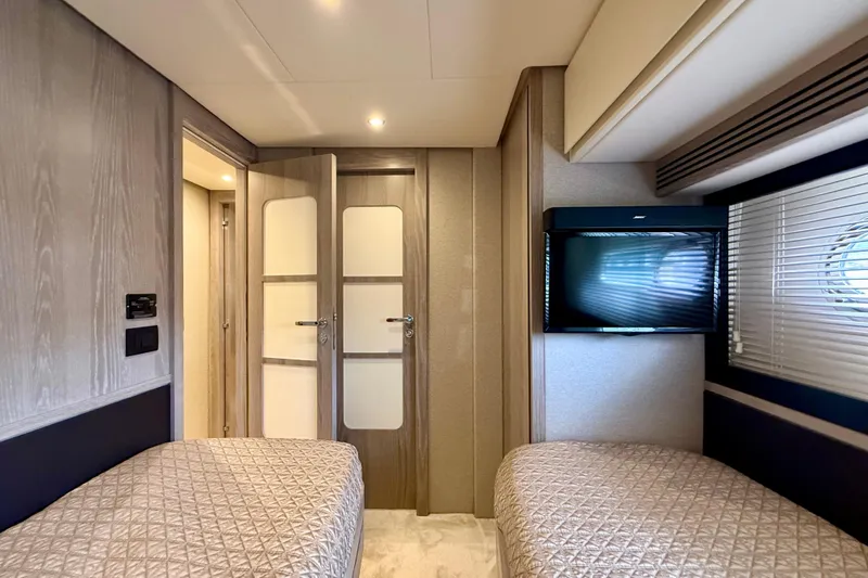 Slide: The Image of Interior of 2020 Azimut Magellano 66 yacht with twin beds and modern decor. - 76