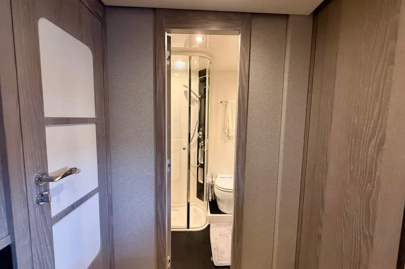 Slide: The Image of Interior view of 2020 Azimut Magellano 66 yacht bathroom with modern design. - 77