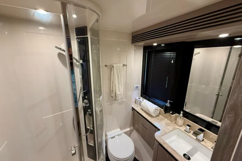 Slide: The Image of Luxurious bathroom in 2020 Azimut Magellano 66 yacht, featuring modern fixtures and elegant design. - 78