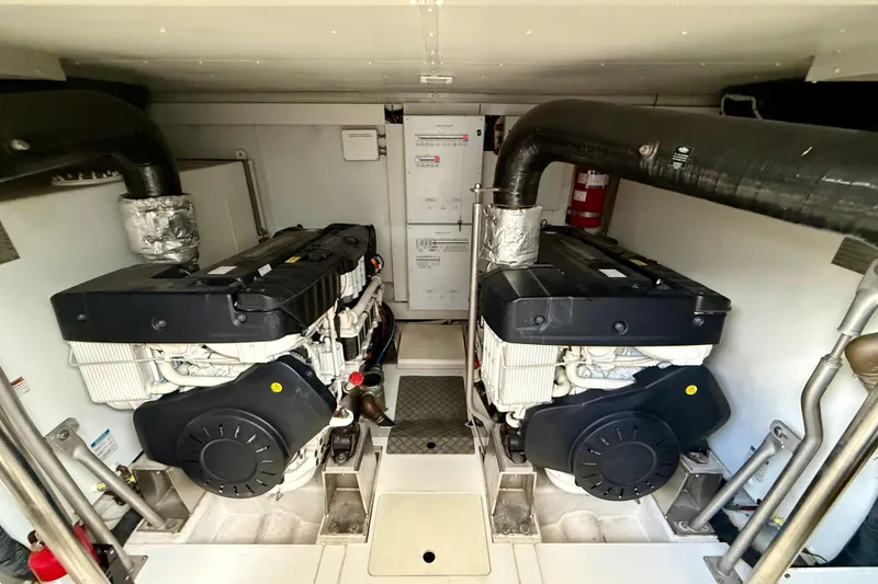 Slide: The Image of Engine room of 2020 Azimut Magellano 66 yacht, featuring dual engines and ventilation system. - 82