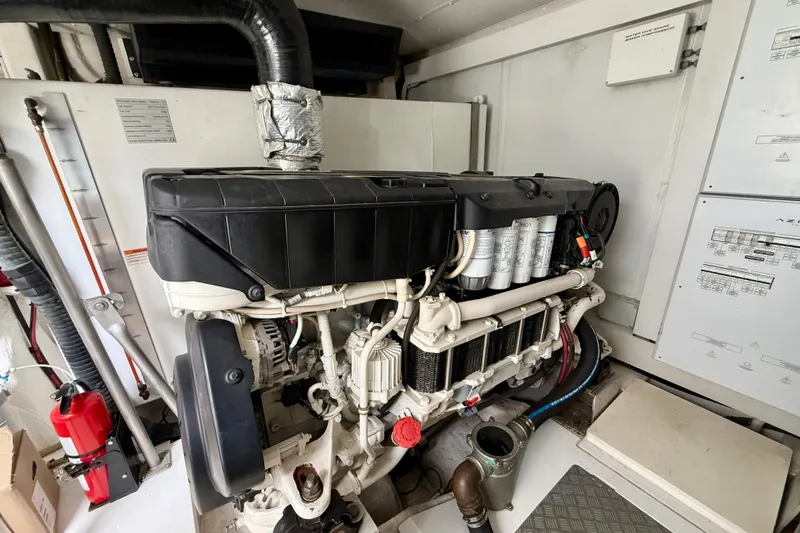 Slide: The Image of Engine room of a 2020 Azimut Magellano 66 yacht, showcasing detailed machinery. - 85
