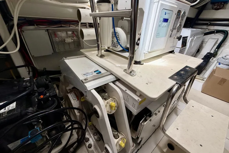 Slide: The Image of Engine room of 2020 Azimut Magellano 66 yacht, showcasing mechanical equipment and controls. - 91