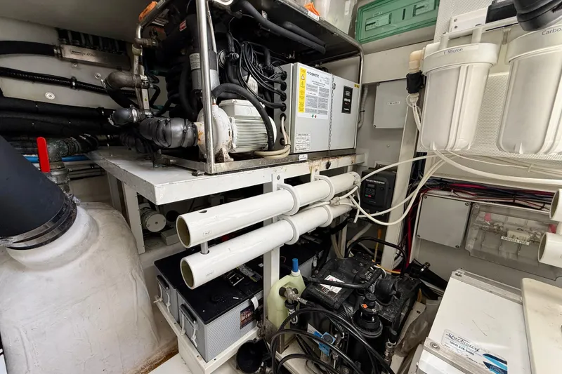 Slide: The Image of Engine room of a 2020 Azimut Magellano 66 yacht, showcasing mechanical components and systems. - 92