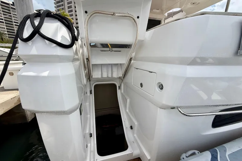Slide: The Image of Entrance to the 2020 Azimut Magellano 66 yacht, showcasing sleek white exterior design. - 93