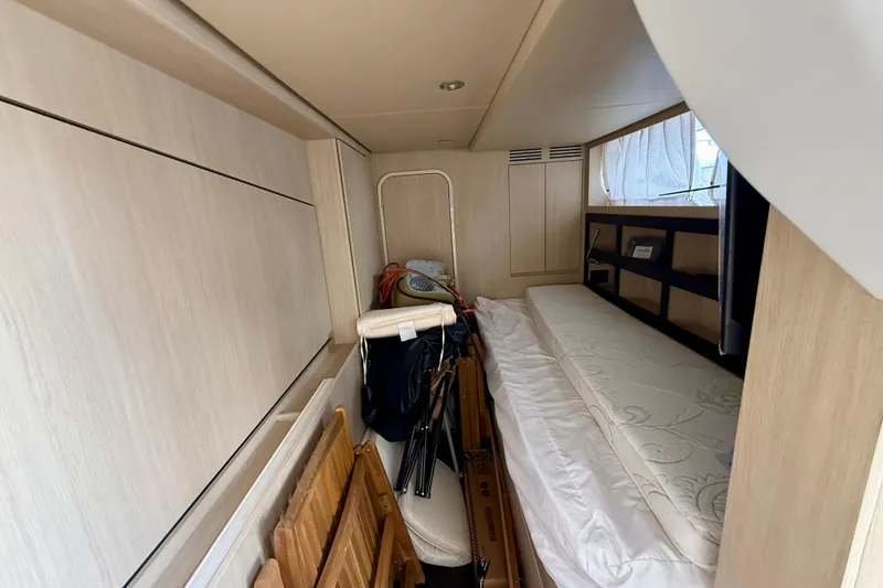 Slide: The Image of Interior cabin of 2020 Azimut Magellano 66 yacht with storage and bed. - 94