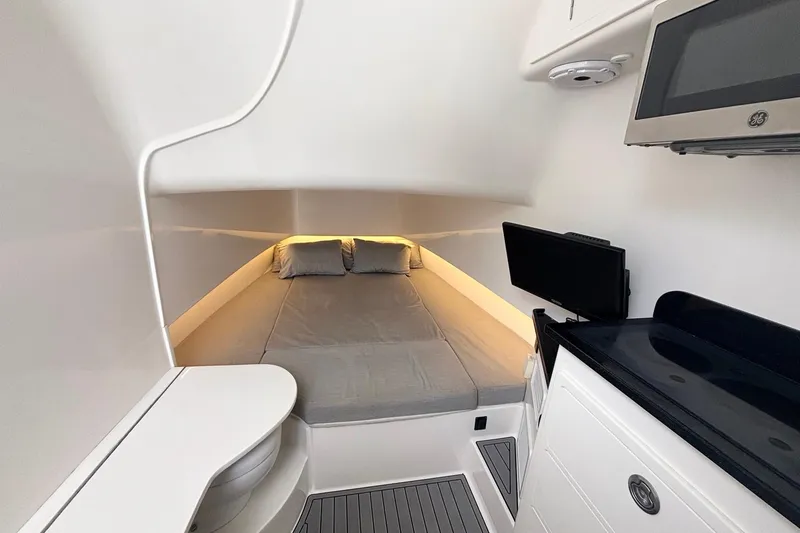 Slide: The Image of Interior cabin of 2021 Contender 39 Fisharound with bed, TV, and kitchenette. - 18