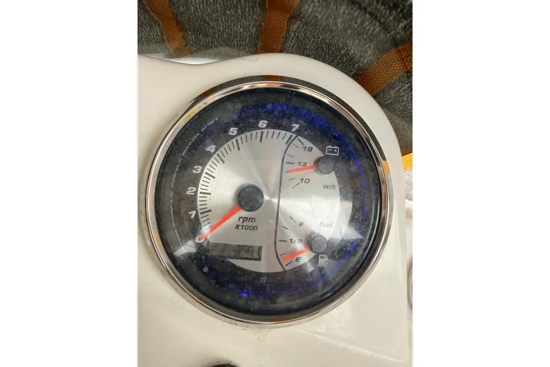 Slide: The Image of Close-up of 2020 Hurricane SunDeck Sport 185 OB dashboard gauge showing RPM, voltage, and fuel levels. - 14