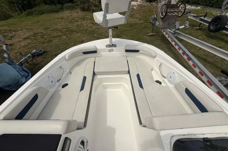 Slide: The Image of 2020 Hurricane SunDeck Sport 185 OB boat interior with white seating and blue accents. - 16