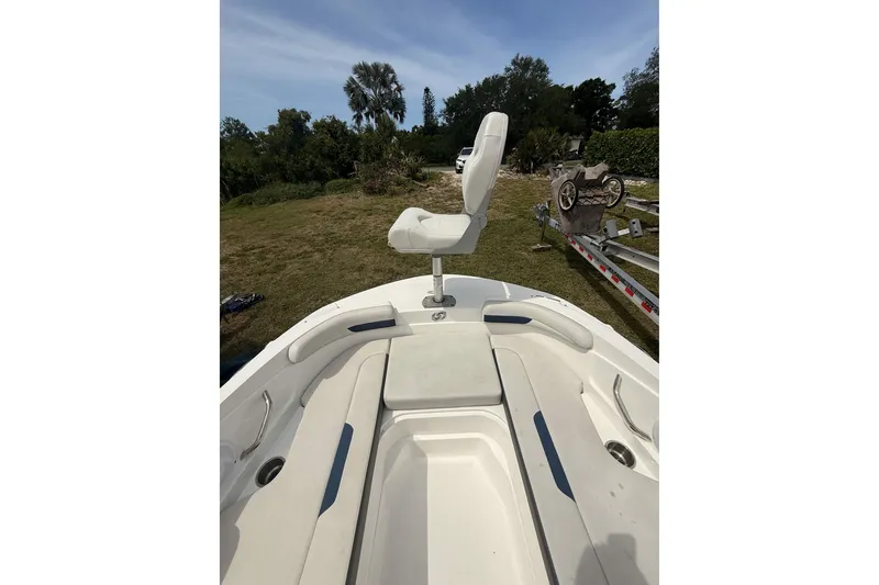 Slide: The Image of 2020 Hurricane SunDeck Sport 185 OB boat interior with seating and swivel chair. - 17