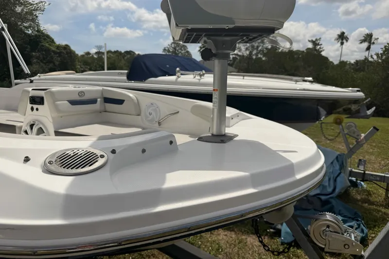 Slide: The Image of 2020 Hurricane SunDeck Sport 185 OB boat on trailer, sunny day, grassy background. - 4