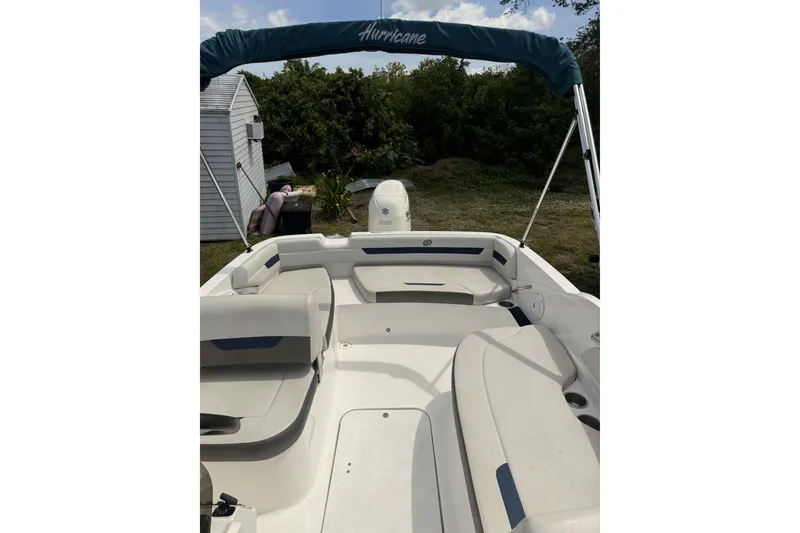 Slide: The Image of 2020 Hurricane SunDeck Sport 185 OB boat interior with seating and canopy. - 6