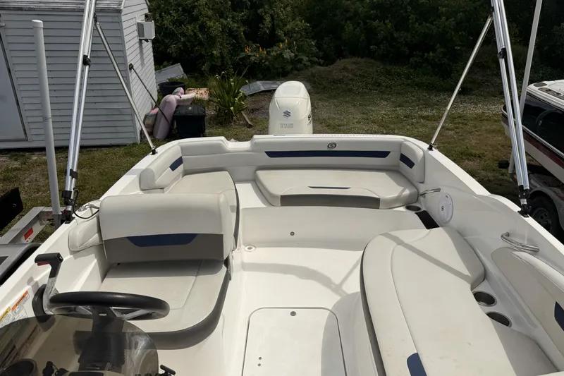 Slide: The Image of 2020 Hurricane SunDeck Sport 185 OB boat interior with seating and steering wheel. - 7
