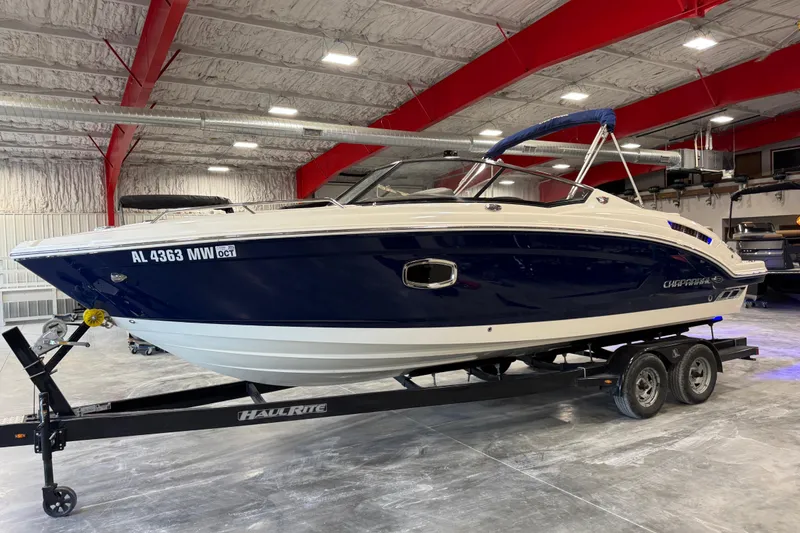 The Image of 2015 Chaparral 257 SSX boat on trailer in indoor storage facility. - 1