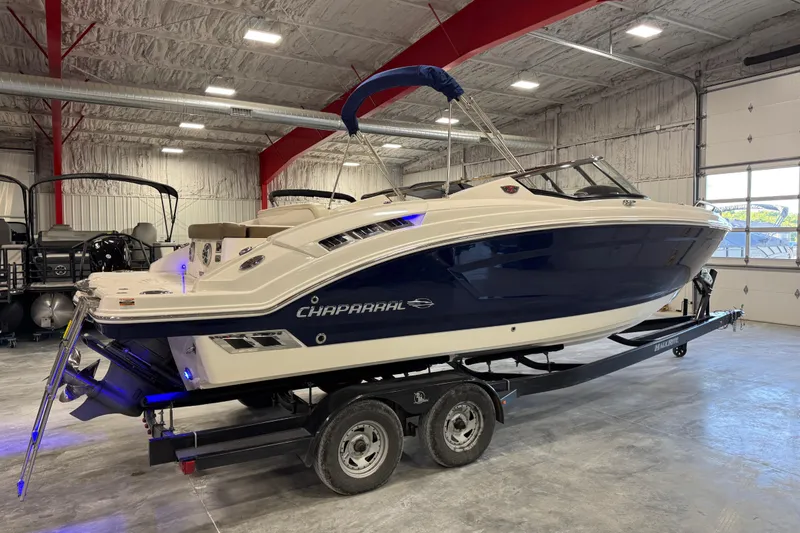Slide: The Image of 2015 Chaparral 257 SSX boat on trailer in indoor showroom setting. - 3