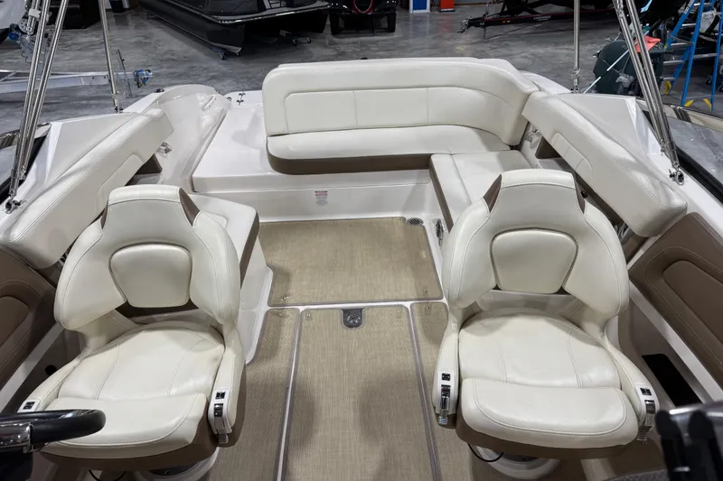 Slide: The Image of Interior of 2015 Chaparral 257 SSX boat with white leather seating and beige flooring. - 8