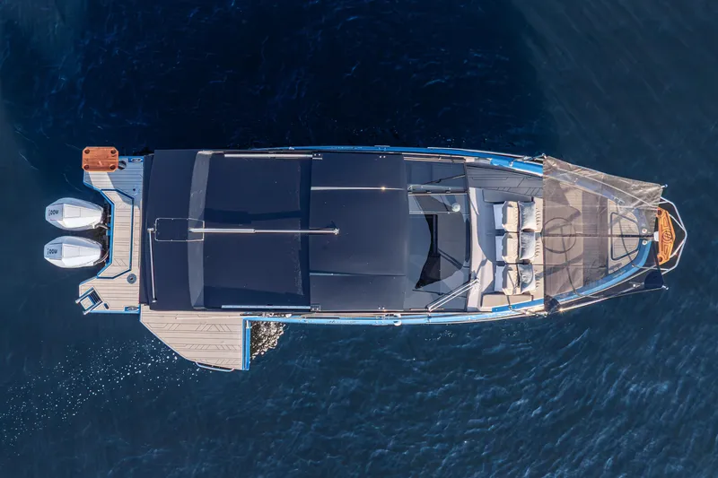 Slide: The Image of Aerial view of 2027 Hanover 347 Outboard boat on calm water. - 17