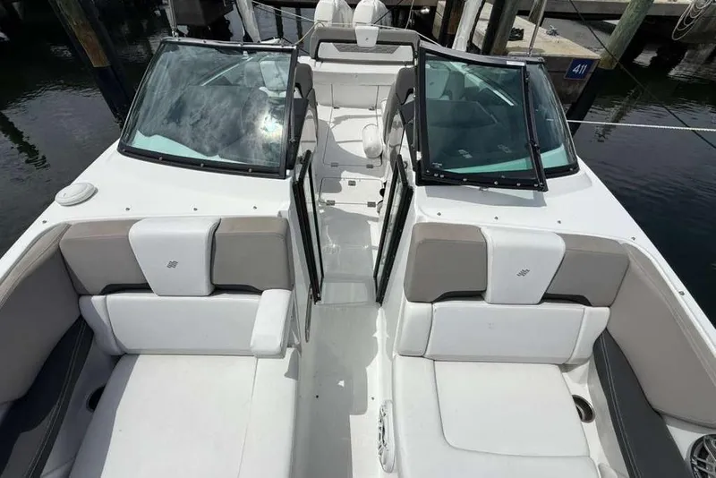Slide: The Image of 2022 Four Winns H290 OB boat interior with spacious seating and sleek design. - 14