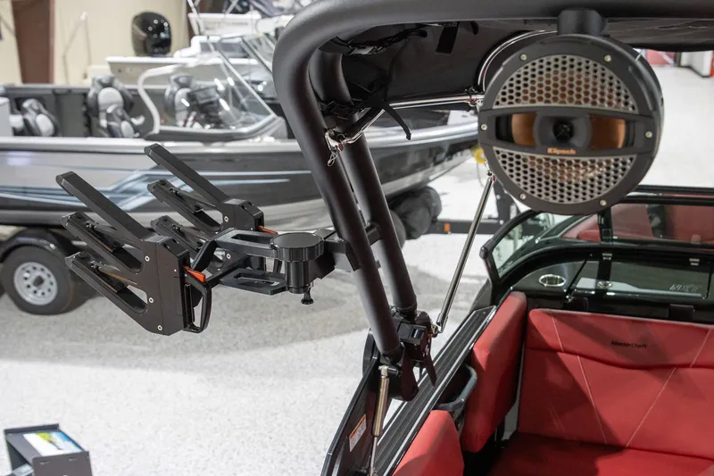 Slide: The Image of 2024 MasterCraft NXT23 boat with speaker and rod holder. - 10