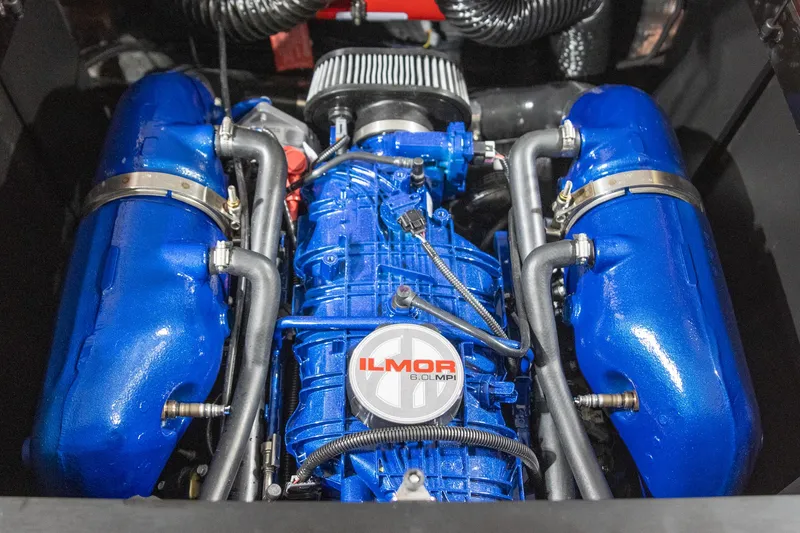 Slide: The Image of 2024 MasterCraft NXT23 Ilmor 6.0L MPI engine in blue. - 11