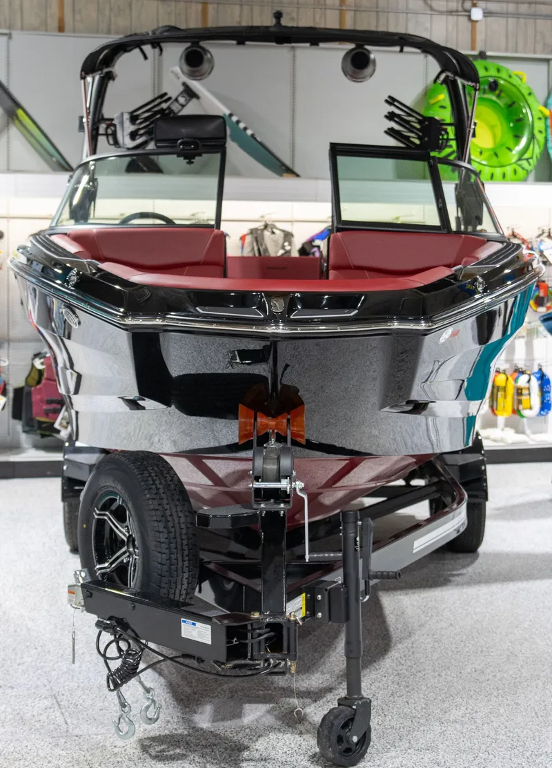 Slide: The Image of 2024 MasterCraft NXT23 boat displayed in showroom. - 4