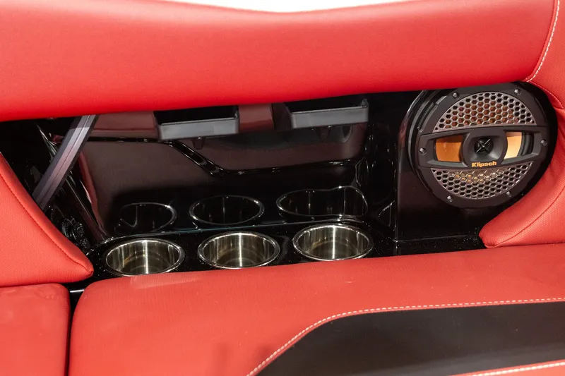 Slide: The Image of 2024 MasterCraft NXT23 interior with speaker and cup holders. - 9