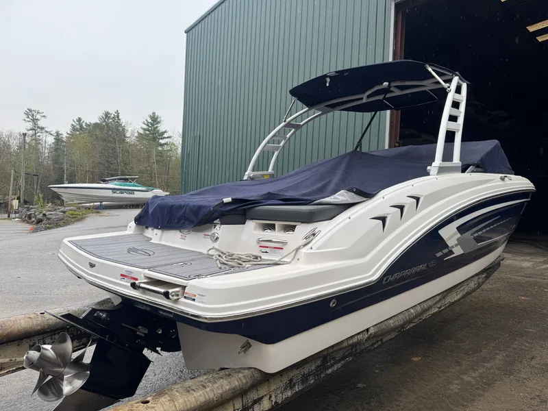 Slide: The Image of 2023 Chaparral 23 SSi boat in storage facility, side view. - 2