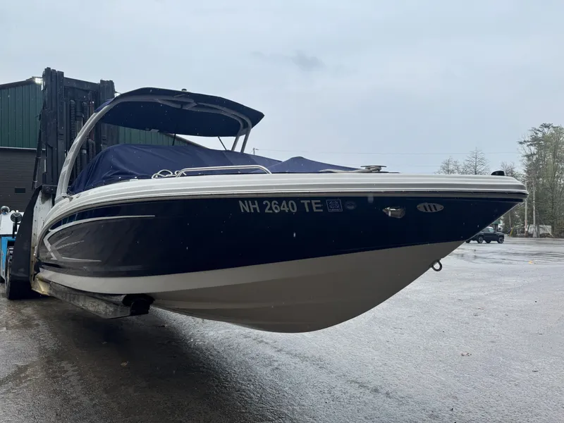 Slide: The Image of 2023 Chaparral 23 SSi boat on a trailer outdoors. - 5