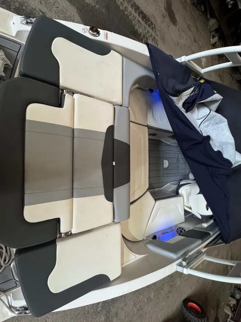 Slide: The Image of Interior of a 2023 Chaparral 23 SSi boat with beige seating. - 8