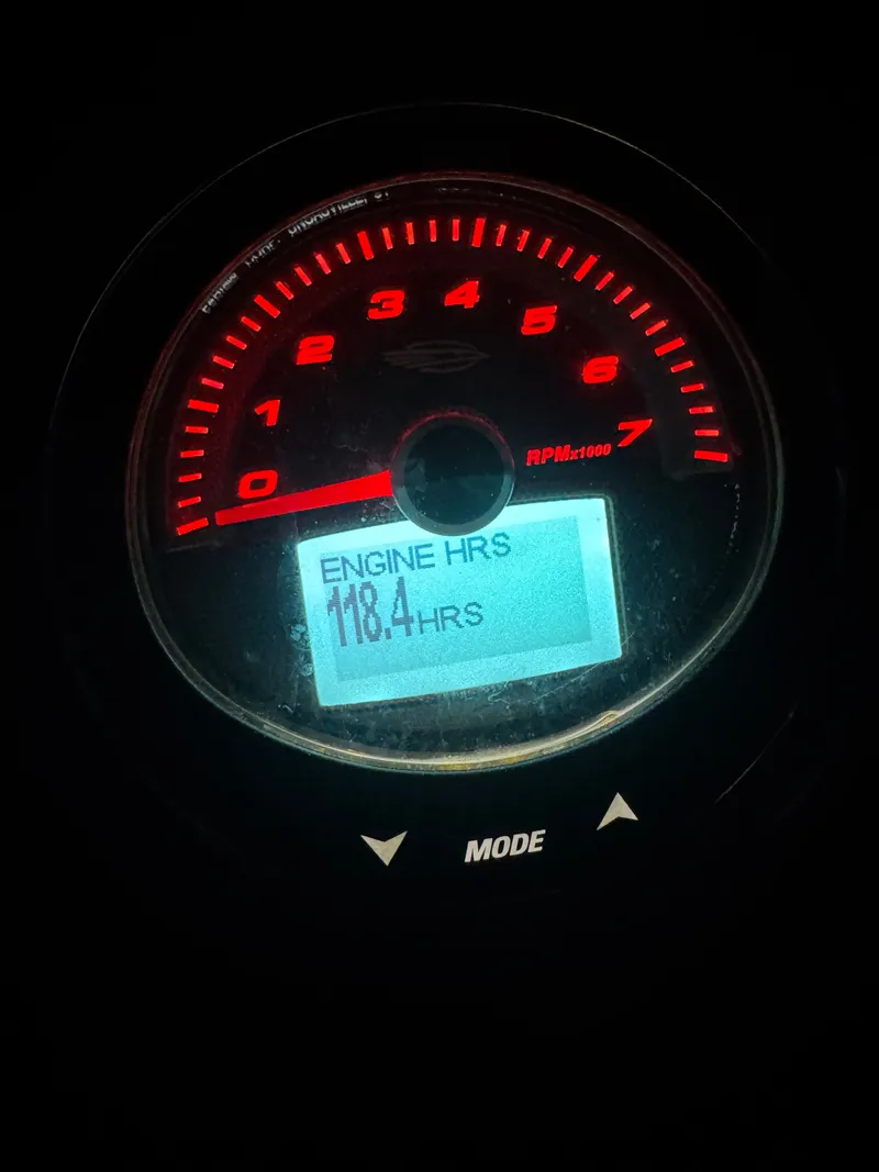 Slide: The Image of Chaparral 23 SSi 2023 tachometer displaying 118.4 engine hours. - 9