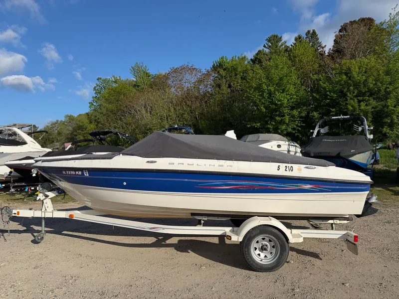 The Image of 2006 Bayliner 185 Sport boat parked on trailer outdoors. - 1