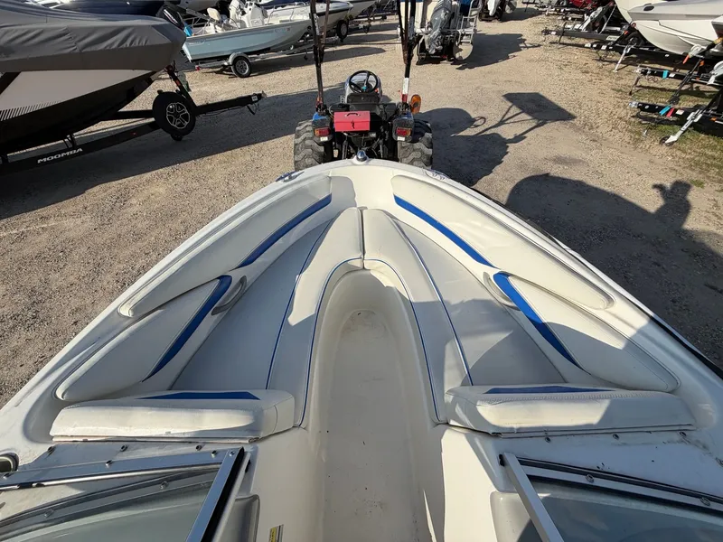 Slide: The Image of 2006 Bayliner 185 Sport boat outdoors on a trailer. - 5