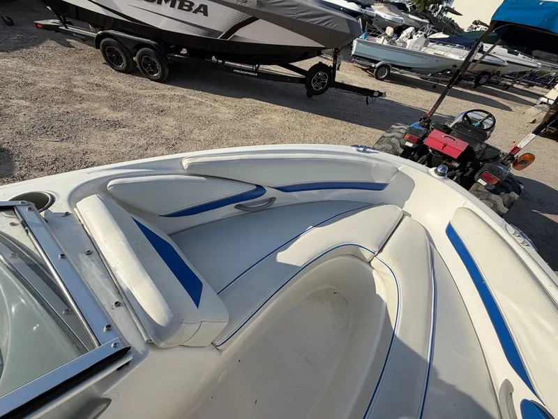 Slide: The Image of Interior view of a 2006 Bayliner 185 Sport boat with blue accents. - 6