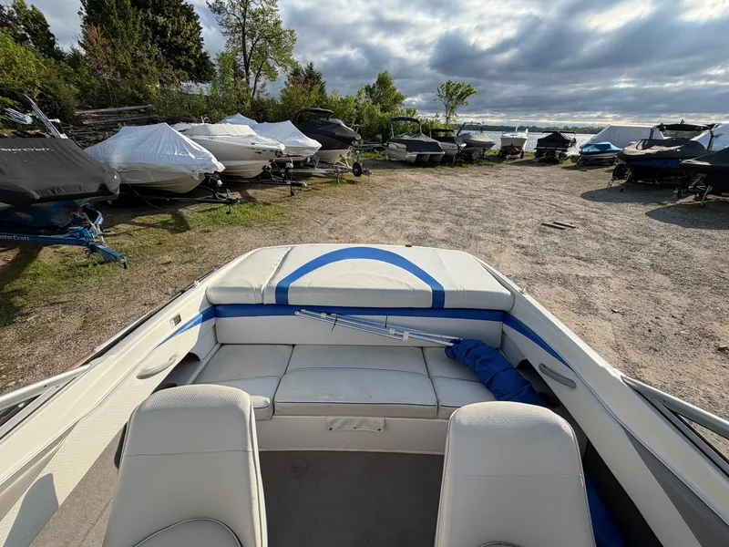 Slide: The Image of 2006 Bayliner 185 Sport boat parked among other boats. - 8