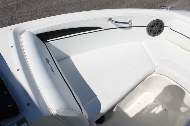 Slide: The Image of Interior of Sea Ray SLX 230 boat, white upholstery, speaker. - 16