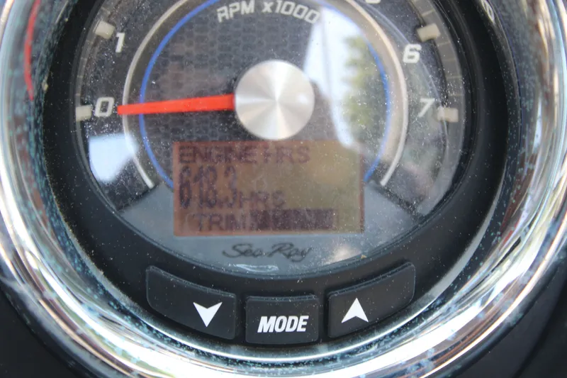 Slide: The Image of Tachometer of a 2014 Sea Ray SLX 230 boat displaying engine data. - 18