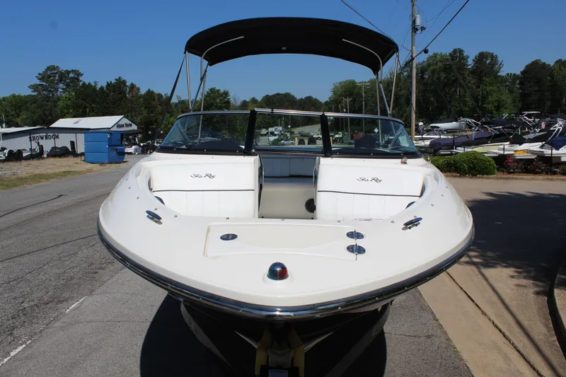 Slide: The Image of 2014 Sea Ray SLX 230 boat on a trailer outdoors. - 4