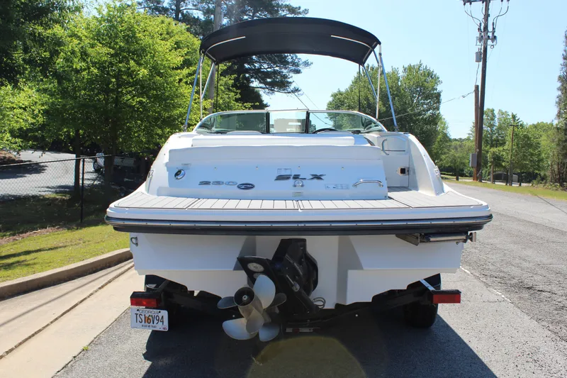 Slide: The Image of Rear view of a 2014 Sea Ray SLX 230 boat on a trailer. - 5