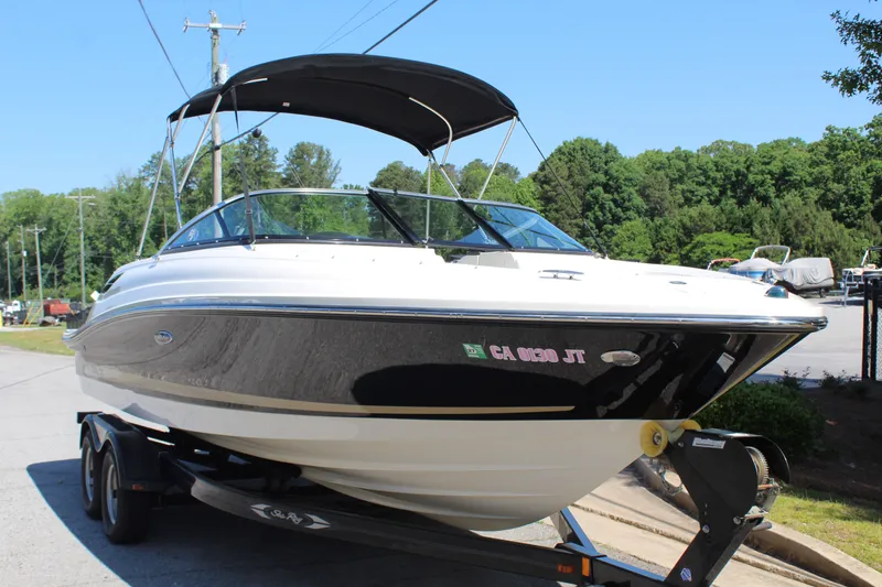 Slide: The Image of 2014 Sea Ray SLX 230 boat on trailer, sunny day. - 8