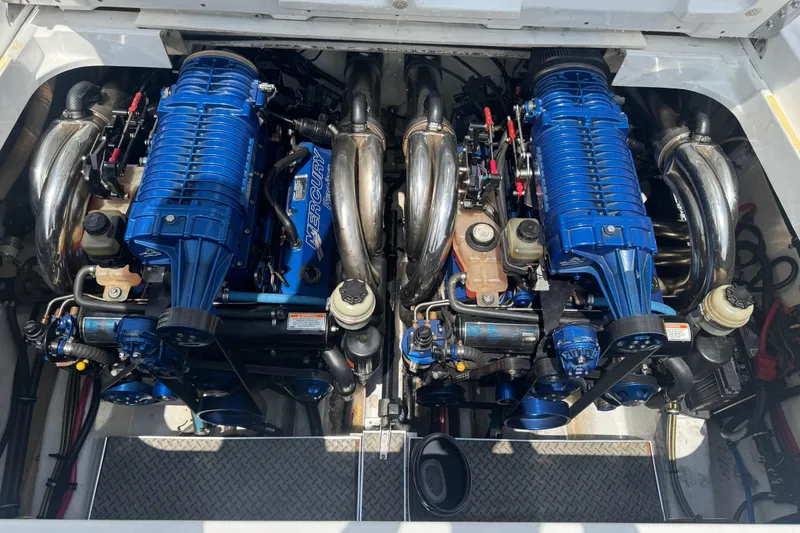 Slide: The Image of Twin Mercury engines in a 2006 Formula 382 FASTech boat, showcasing powerful performance. - 12
