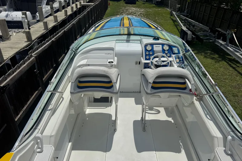 Slide: The Image of 2006 Formula 382 FASTech boat cockpit with dual seats and vibrant dashboard. - 3