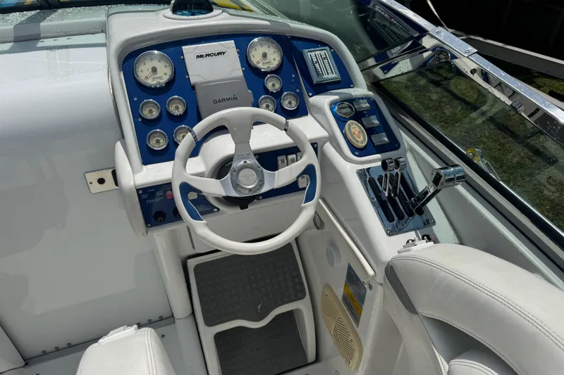 Slide: The Image of Cockpit of 2006 Formula 382 FASTech boat with steering wheel and control panel. - 4