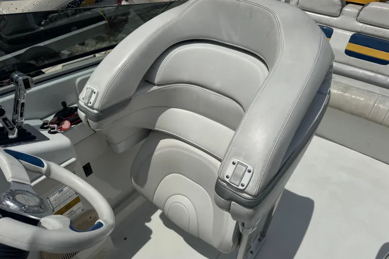 Slide: The Image of 2006 Formula 382 FASTech boat interior with white leather seating and steering wheel. - 6