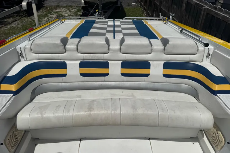 Slide: The Image of 2006 Formula 382 FASTech boat interior with white, blue, and yellow seating. - 7